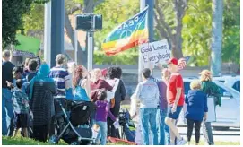  ?? JOE CAVARETTA/STAFF PHOTOGRAPH­ER ?? About 50 people gathered to protest Mike Pence’s appearance, calling attention with signs and rainbow flags to his past opposition to same-sex marriage and gay rights.