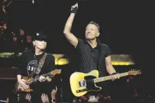  ?? AP PHOTO/CHRIS O’MEARA ?? Singer Bruce Springstee­n (right) and E Street Band member Nils Lofgren perform during their 2023 tour on Wednesday at Amalie Arena in Tampa, Fla.