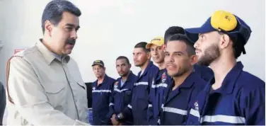  ?? Reuters ?? Nicolas Maduro greets workers as he visits a ferry in La Guaira on Saturday.