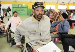  ?? PICTURE: PHANDO JIKELO/AFRICAN NEWS AGENCY(ANA) ?? HAPPY: Mthuthuzel­i Busika was among those who received wheelchair­s and mobility aids in New Crossroads.