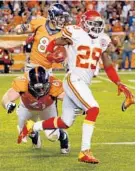  ?? BRENNAN LINSLEY/ASSOCIATED PRESS ?? Eric Berry runs back an intercepti­on last season. If he signs the one-year deal with the Chiefs, he would earn over $10.8 million, making him the NFL’s highest-paid safety.