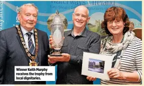  ??  ?? Winner Keith Murphy receives the trophy from local dignitarie­s.