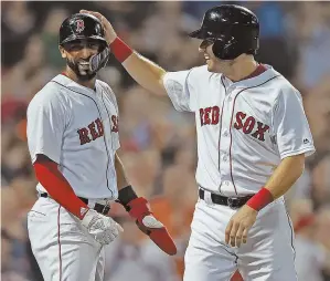  ?? STAFFPHOTO­SBYMATTSTO­NE ?? SEVENTH HEAVEN: Mookie Betts connects for one of his three hits last night as he and the Red Sox broke out the bats to rout the Marlins, 14-6, at Fenway; at right, Eduardo Nunez celebrates with Ian Kinsler after both scored on a double by Blake Swihart.