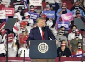  ?? John Bazemore / Associated Press ?? President Donald Trump speaks during a campaign rally at Middle Georgia Regional Airport on Friday in Macon, Ga.