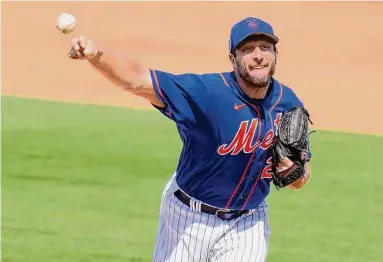  ?? Lynne Sladky/Associated Press ?? New York Mets starting pitcher Max Scherzer throws during the third inning of a spring training game against the Washington Nationals on Friday in Port St. Lucie, Fla.