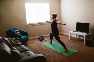  ?? ?? Taub does yoga after a full day of performing abortions at the Trust Women clinic, which has seen demand surge since a recent Texas law banned nearly all abortions in the state.