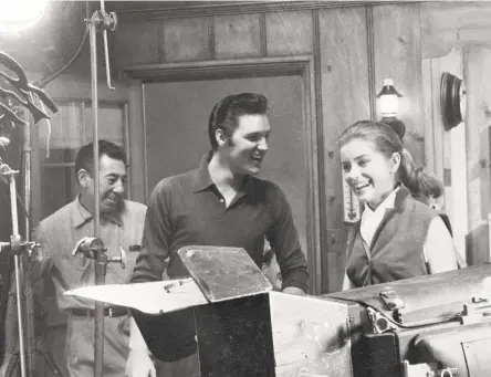  ?? Bettmann Archive ?? Above, Elvis Presley relaxes at a recording session with then-actress Dolores Hart for the 1957 movie “Loving You.” Hart has lived as a nun in Bethlehem, Conn., for 56 years. Below, posters and publicity shots from her film career remain. “Francis of Assisi” and “Where the Boys Are” with George Hamilton are among the most memorable.