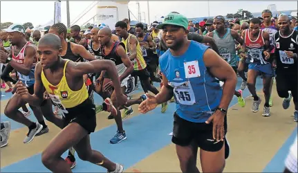  ?? Picture: MICHAEL PINYANA ?? THEY’RE OFF: The runners get moving at the start of the Africa Day half marathon held at the Jan Smuts stadium yesterday