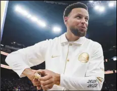  ?? Associated Press ?? Golden State Warriors guard Stephen Curry reacts after receiving his 2021-2022 NBA championsh­ip ring before the team’s game against the Lakers on Oct. 18 in San Francisco.