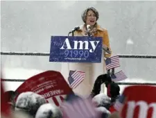  ?? AP PHOTOS ?? A SNOWY DAY: Democratic Sen. Amy Klobuchar addresses a snowy rally Sunday at Boom Island Park in Minneapoli­s, where she announced she is entering the race for president.