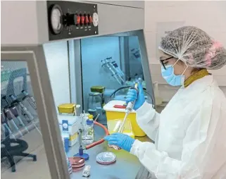  ?? /Bloomberg ?? Vaccine visions:
A technician uses a single channel pipette dropper inside the Afrigen Biologics & Vaccines laboratory facility in Cape Town. SA is among many countries eager to produce its own mRNA Covid-19 shots.