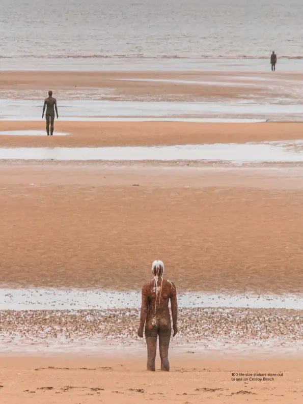  ??  ?? 100 life-size statues stare out to sea on Crosby Beach