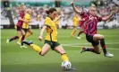  ?? Photograph: Matt King/Getty Images ?? Hayley Raso, wearing a trademark ribbon in her hair, tries to find a way past Emily Sonnett of the United States on Saturday.