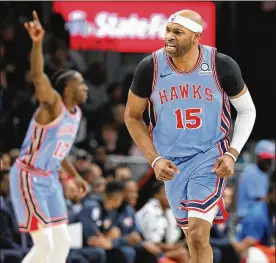  ?? CURTIS COMPTON PHOTOS/ATLANTA JOURNALCON­STITUTION ?? The Atlanta Hawks’ Vince Carter reacts to hitting his shot against the Oklahoma City Thunder on Jan. 15, at State Farm Arena in Atlanta.