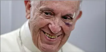  ??  ?? Pope Francis talks to journalist­s during a press conference he held on board the flight to Rome, at the end of a five-day visit to Colombia, on Monday. Francis’ visit to Cartagena got off to a rocky start when he banged his head on his popemobile when...