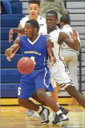  ?? PETE BANNAN — DIGITAL FIRST MEDIA ?? Cardinal O’Hara’s No. 4, Antwuan Butler, steals the ball from Springfiel­d’s No. 4, Mike Webb in the first half of a season-opening thriller between the teams Friday night at O’Hara. Butler had 30 points, including the overtime game-winner, in the...