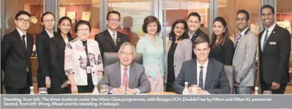  ??  ?? Standing, from left: The three students under the Hilton Class programme, with Berjaya UCH, DoubleTree by Hilton and Hilton KL personnel. Seated, from left: Wong, Mead and Ho (standing, in kebaya).