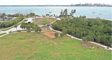  ?? PHOTOS BY THOMAS BENDER/HERALD-TRIBUNE ?? Ken Thompson Park features a dramatic view of Sarasota and the bay. It features canoe and kayak launches, a fishing pier, picnic area, playground, boat ramp, electric vehicle charger, walking paths and restrooms. City leaders are still considerin­g a proposal by Ride Entertainm­ent to revamp the park through a public-private partnershi­p that would bring in new attraction­s.