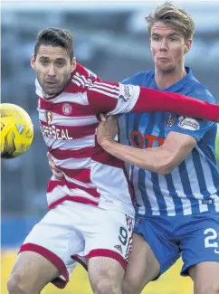  ??  ?? Holding game Accies striker Alex D’acol is gripped by Kristoffer Ajer as he tries to win possession