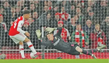  ?? (AFP) ?? Arsenal's Reiss Nelson (left) shoots past Leeds United's Illan Meslier for the only goal of the match in London, UK, on Monday