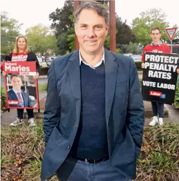  ?? Picture: MARK WILSON ?? BOUNDARY CHANGES: Federal MP for Corio Richard Marles outside Highton with Deakin University Labor Club students Tegan Whitten and Kye Cole at the weekend.