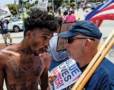  ??  ?? SIMMER DOWN Constructi­ve solutions could serve to ease current political tensions. Left: An argument at a propolice demonstrat­ion in California in June.