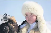  ??  ?? Aisholpan Nurgaiv has become a symbol of the Kazakh minority since she was featured in the 2016 documentar­y The Eagle Huntress.