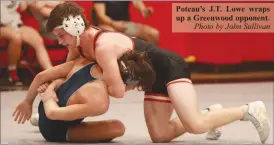  ?? Photo by John Sullivan ?? Poteau’s J.T. Lowe wraps up a Greenwood opponent.