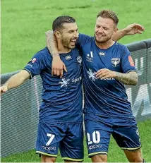  ?? GETTY ?? Phoenix striker Kosta Barbarouse­s, left, celebrates their second goal with David Ball in Palmerston North yesterday.