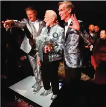  ??  ?? Fashion designer Nick Graham, left, appears with his guest models, astronaut Buzz Aldrin, center, and Bill Nye, star of TV's "Science Guy," after unveiling his Mars-themed collection during men's Fashion Week in New York. — AP photos