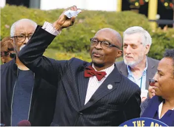  ?? ETHAN HYMAN AP ?? The Rev. T. Anthony Spearman, president of the North Carolina NAACP, crumples up a mailer that tells voters IDS are needed in the upcoming 2020 election during a news conference Friday in Raleigh, N.C.