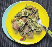  ?? DEB LINDSEY FOR THE WASHINGTON POST ?? Potato salad with kale pesto: potatoes are better for you than you might realize.