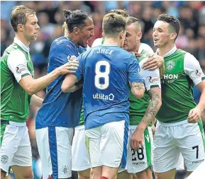  ??  ?? Ryan Jack was red carded for this clash with Hibs’ Anthony Stokes.