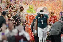  ?? ROSS D. FRANKLIN — THE ASSOCIATED PRESS ?? A disappoint­ed jalen Hurts walks off the field after the Eagles lost to the Kansas City Chiefs in Super Bowl LVII Sunday, 38-35 in Glendale, Ariz. The Chiefs kicked a late field goal to win their second NFL title in four years despite the play of Hurts, who ran for three TDs and threw for one.