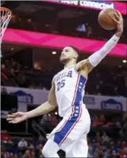  ?? NELL REDMOND — THE ASSOCIATED PRESS ?? Sixers guard Ben Simmons slams home a dunk in the second half against Charlotte Sunday.