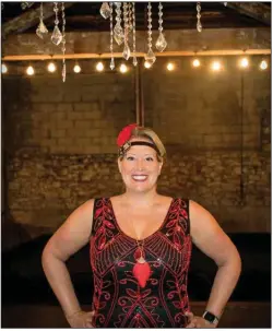  ?? (Arkansas Democrat-Gazette/Cary Jenkins) ?? Dr. Jessica Cannon sports a flapper costume at the 1920s era Hamp Williams Building in Hot Springs where Prohibitio­n will take place. Cannon is president of the Hot Springs Junior Auxiliary which is hosting the fundraiser.