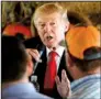  ?? AP/EVAN VUCCI ?? Republican presidenti­al candidate Donald Trump, meeting with farmers Monday in Boynton Beach, Fla., said many of the public opinion polls that show him trailing Hillary Clinton are biased and being used to discourage supporters.