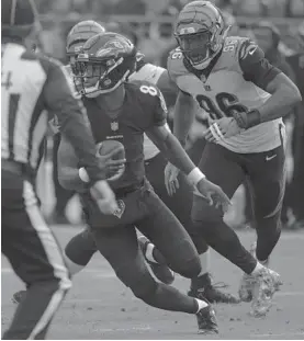  ?? KARL MERTON FERRON/BALTIMORE SUN ?? Lamar Jackson rushed 147 times for 695 yards and five touchdowns last season, helping the Ravens reach the playoffs for the first time since 2014.