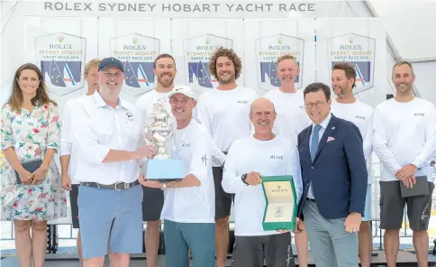  ?? — AFP photo ?? This handout photograph from Rolex/Studio Borlenghi taken and released December 30, 2018 shows crewmember­s of Australia’s Alive yacht posing during a prize-giving ceremony following the Sydney to Hobart yacht race, in Hobart.