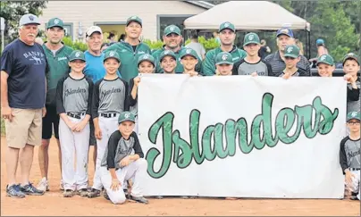  ?? SUBMITTED ?? The Capital District Islanders mosquito AAA baseball team hoist its banner at the opening ceremonies of the recent Fiddler MacDonald Memorial tournament. The host squad reached the semifinals. Pictured are, front row, from left, Thatcher Hughes and...