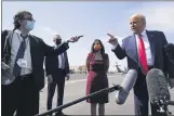  ??  ?? President Donald Trump talks to reporters at Phoenix Sky Harbor Internatio­nal Airport on Monday. ALEX BRANDON — THE ASSOCIATED PRESS