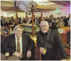  ?? PHOTO BY DIANE MCNAMARA ?? George Wendt, left, and John Ratzenberg­er hold court at a pop-up Cheers at the Westin Copley Place hotel for the Mortgage Bankers Associatio­n’s annual get-together.