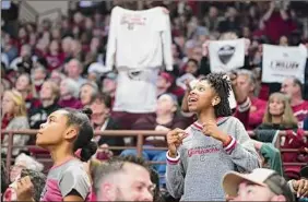  ?? Sean Rayford / Associated Press ?? A young South Carolina fan dances during a timeout in a second-round game. Attendance is up 60 percent in the first two rounds over five years.