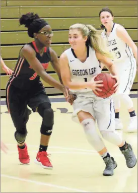  ??  ?? Faith Alexander looks to drive the lane during the Lady Trojans’ home game with Bowdon this past Saturday. (Photo by Stacy Smith)
