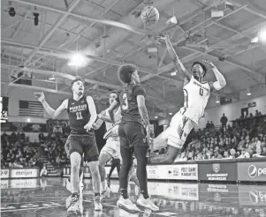  ?? JUNFU HAN/DETROIT FREE PRESS ?? Oakland guard Rocket Watts makes a jump shot against Purdue Fort Wayne during the first half of a Horizon League tournament quarterfin­al game in Rochester on Thursday night.