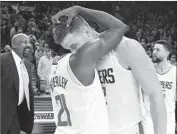  ?? Steve Dykes Associated Press ?? CLIPPERS’ Blake Griffin is hugged by Patrick Beverley after he hit the game-winning shot in Portland.