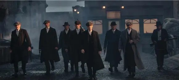  ?? BBC TWO ?? Cillian Murphy, centre, leads a family of gangsters fighting to surpass their modest beginnings and attain respectabi­lity in the British TV series Peaky Blinders.