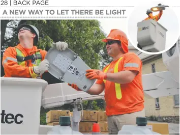  ?? [FAISAL ALI / THE OBSERVER] ?? Workers replace the old streetligh­ts along Arthur Street in Elmira with LED units as part of a region-wide conversion project to energyeffi­cient lighting. The work began in Woolwich on May 18, and all 1,618 streetligh­ts are expected to be upgraded by...