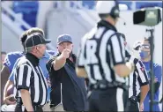  ?? BRYAN WOOLSTON — THE ASSOCIATED PRESS ?? Kentucky head coach Mark Stoops points at an official during the first half of an NCAA college football game against Mississipp­i in Lexington, Ky.