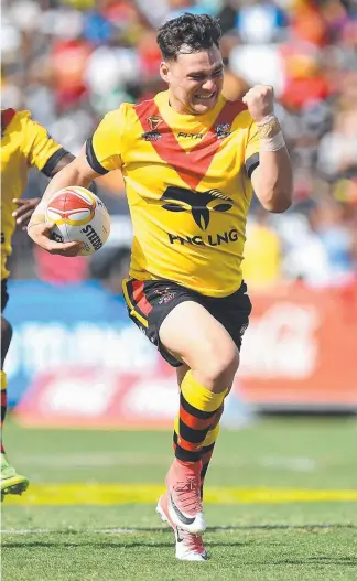  ?? Picture: GETTY IMAGES ?? Lachlan Lam of Papua New Guinea celebrates as he goes in to score a try during the 2017 Rugby League World Cup match against the United States.